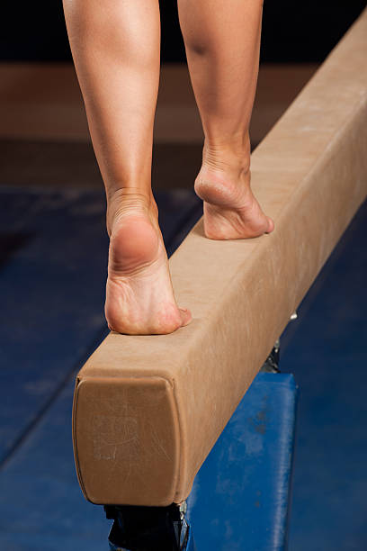 istock Gymnast walking on tiptoes down balance beam (XXXL) 165167727