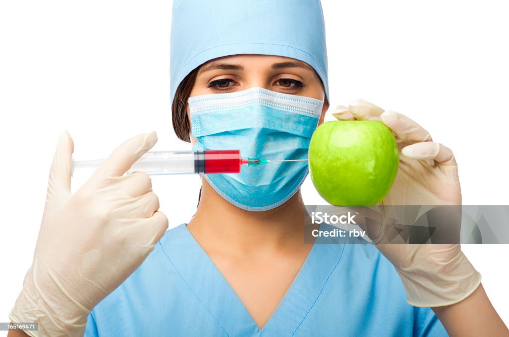 Médico com Seringa e maçã - Foto de stock de 20-24 Anos royalty-free