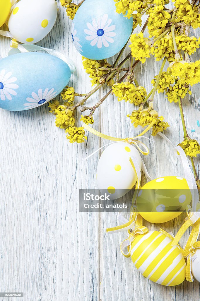 Easter colorful eggs decoration Easter colorful eggs decoration and yellow branches in blossom Artificial Stock Photo