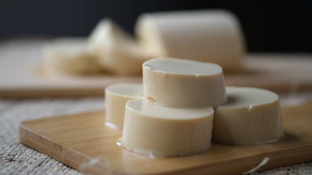 istock Japanese Silken tofu on a wooden choping board. 1651698451