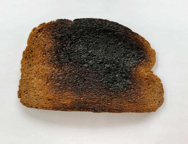 istock Burnt slice of brown bread toast 1651724581