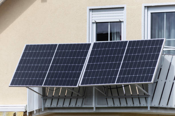 balcony power plant with rooftop house facade stock photo