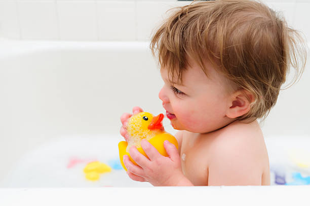 istock Toddler Playing In The Bath Tub 165175251