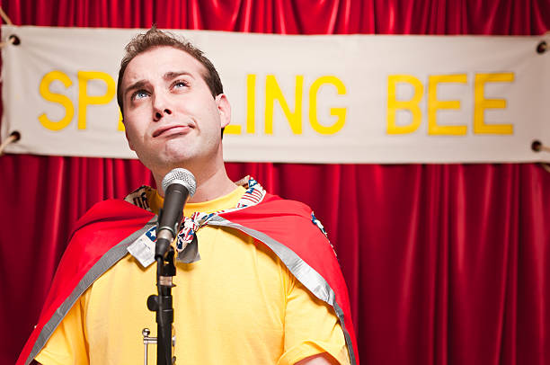 Spelling Bee Contestant Adult man pretending to be a kid in a spelling bee. spelling bee stock pictures, royalty-free photos & images