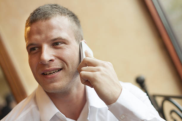 istock Good news! Men speaking on phone 165177874