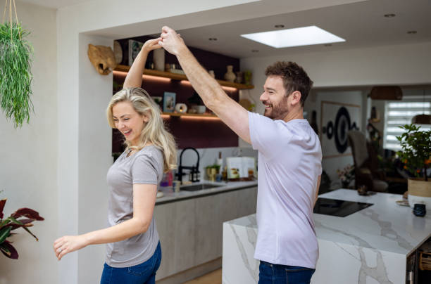 istock Loving couple dancing together at home 1651778768