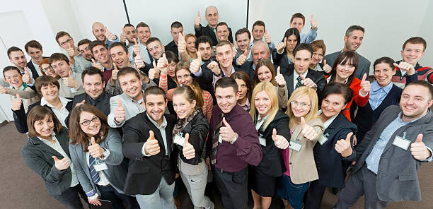 istock Business people holding their thumbs up. 165177908
