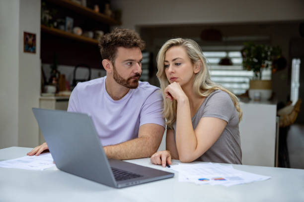 istock Couple checking their home finances and looking worried 1651779245