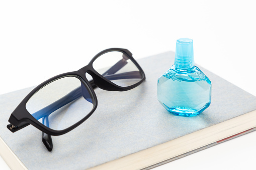 The eyeglasses isolated on an orange background