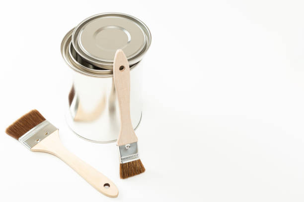 istock Paint brushes and paint cans on white background. 1651795644