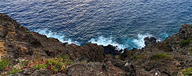 The rocky shoreline at Makapu‘u Point is swept by waves.