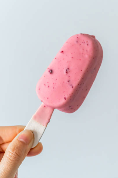 istock Holding a pink ice cream 1651813637
