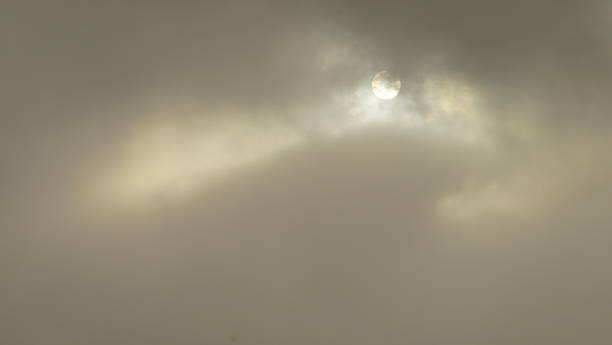 istock Clouds in the sky with the sun in the backgroundbe used as background 1651830423