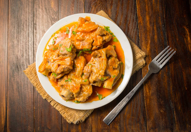 istock Pork trotters in sauce 1651845742