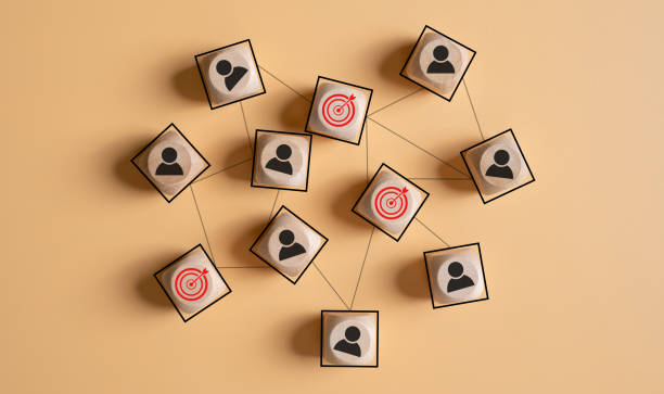 istock Red dartboard sign as a target connected with many business person or working staff. Target customer or Human resource, head hunter concept 1651860801