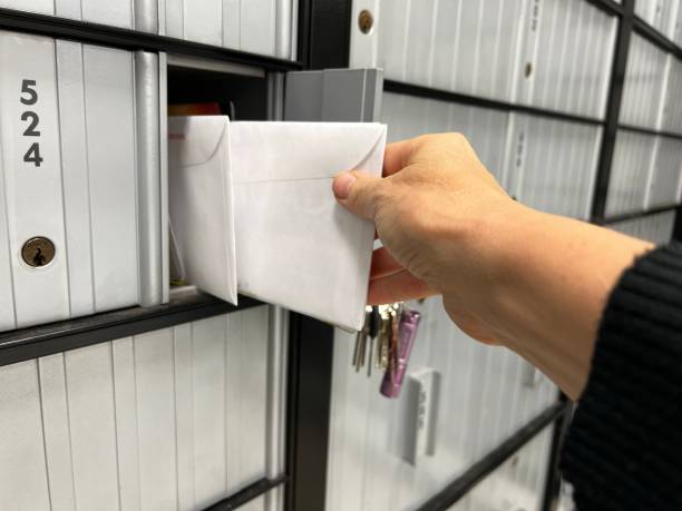 istock Person retrieving mail out of mailbox 1651878001