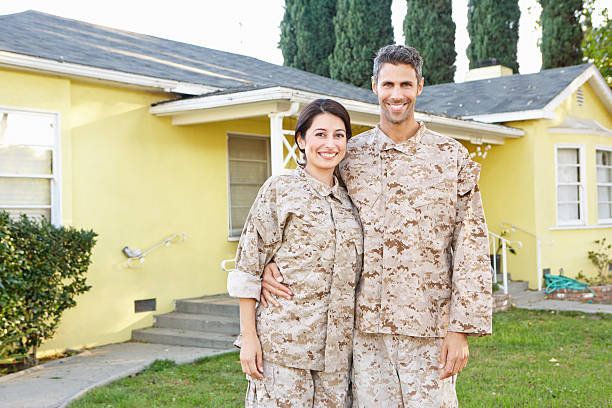 istock Military Couple In Uniform Standing Outside House 165188096