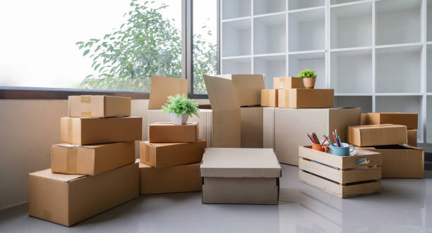 istock Moving day. Cardboard box and cleaning things for moving into a new home 1651903634