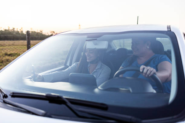 istock Two female friends taking a selfie while driving a car 1651933681