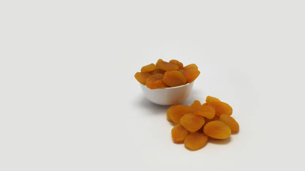 istock Dried apricots isolated on white background 1651968323