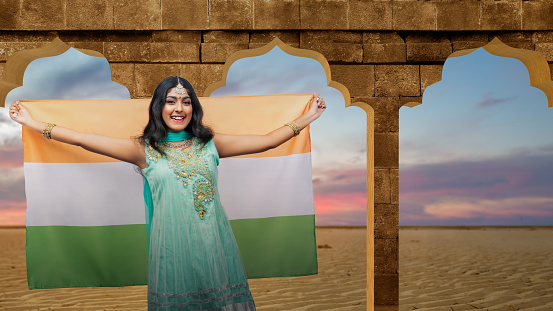 Indian woman holding Indian flag. India Independence Day concept