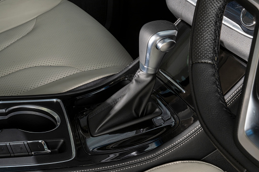 Steering wheel, shift lever, dashboard. Modern car interior