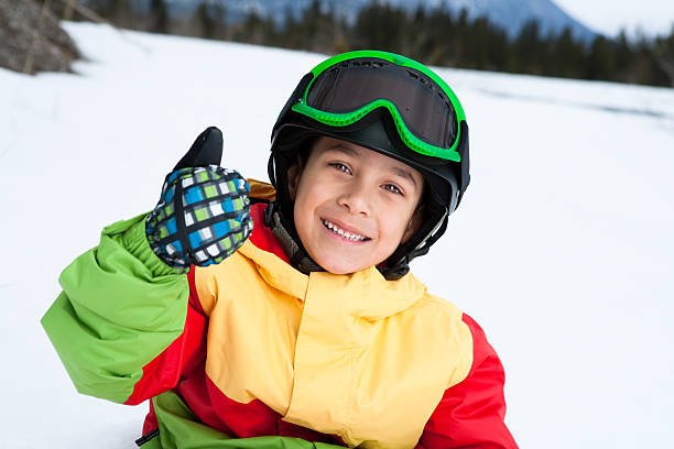 istock Young boy snowboarder with thumbs up 165200177