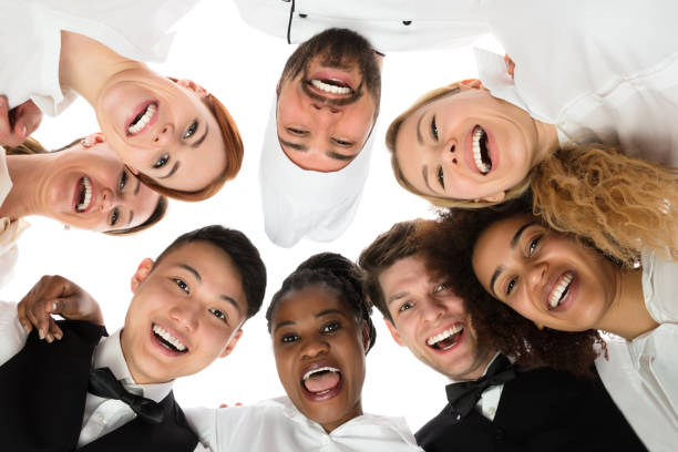 istock Smiling Restaurant Staff Standing Against White Background 1652005938
