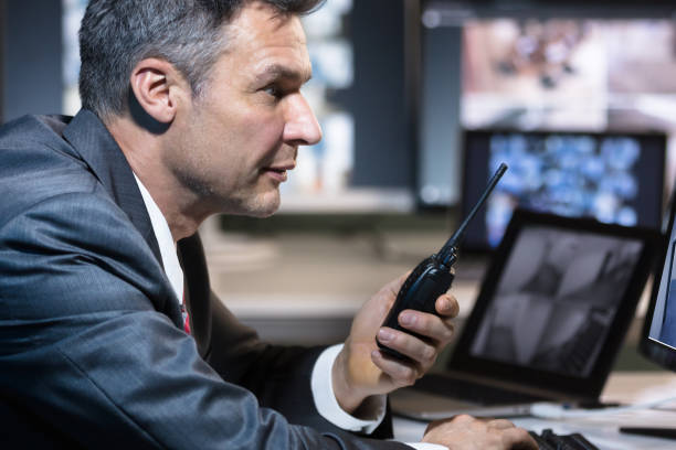 istock Side View Of A Businessman Talking On Walkie Talkie 1652005954