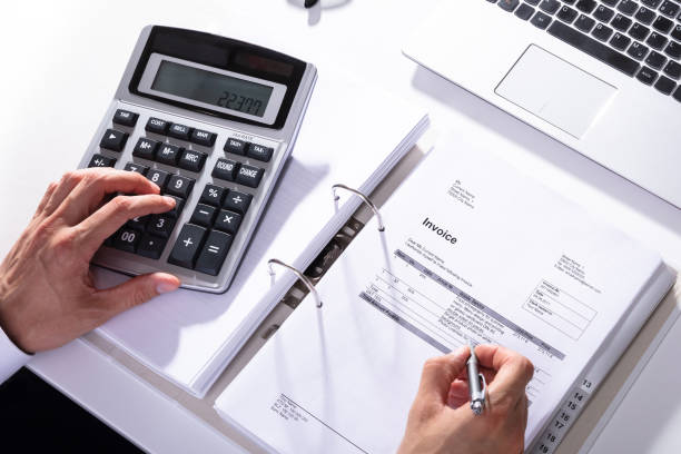 istock High Angle View Of Businessperson Calculating Invoice 1652006071