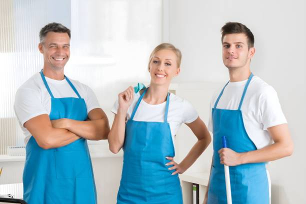 istock Janitors With Vacuum Cleaner And Cleaning Equipments 1652006440