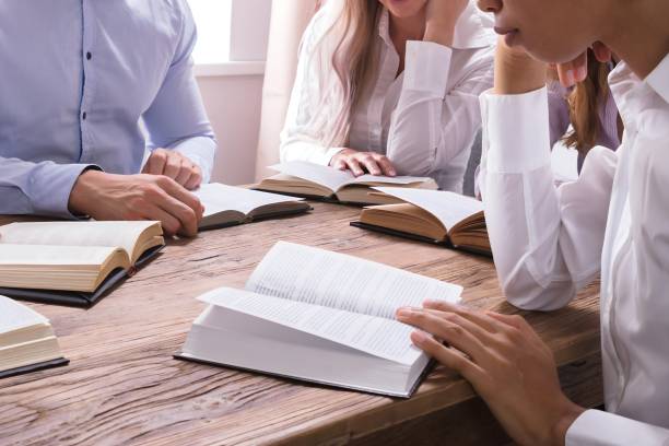 istock Group Of Young Multiethnic People Reading Bible 1652006478