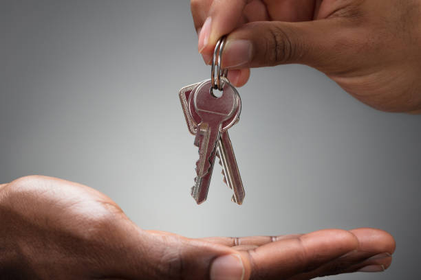 istock Hand Passing Keys To New Owner 1652009245