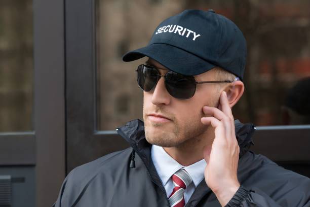 istock Security Guard In Front Of The Door Entrance 1652009275