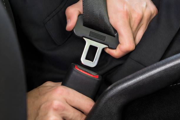 istock Man Fastening Seat Belt In Car 1652009309