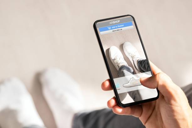 istock Man Trying Virtual Sneakers In Online Shop 1652009345