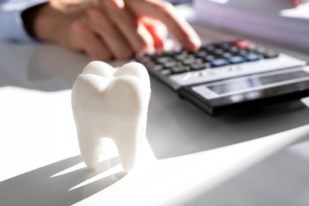 istock Tooth In Front Of Businessperson Calculating Bill 1652009358