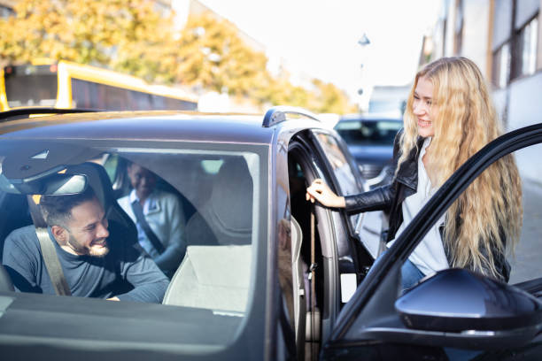 istock Woman Sitting In Car With Friends 1652009377