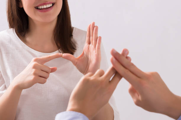 istock Young Woman And Man Talking With Sign Language 1652009383