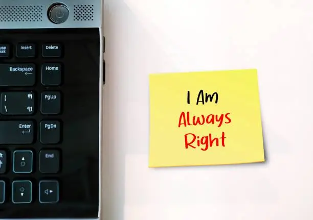 Photo of Laptop on white background I AM ALWAYS RIGHT, means one who so keen to be always right, hard to accept feelings or viewpoint of others