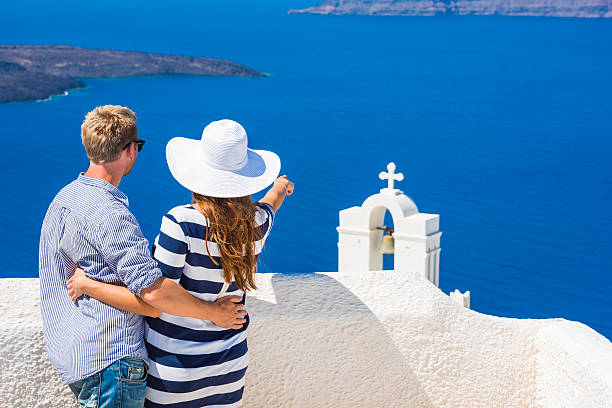 istock Happy young couple on Santorini island, Greece 165202984
