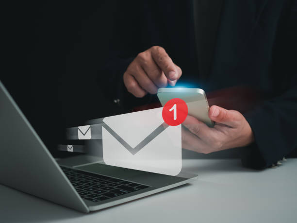 istock Businessman checking email on the phone screen. New email notification concept for business email communication and digital marketing. Inbox receives notification of electronic messages. Internet technology. 1652045596