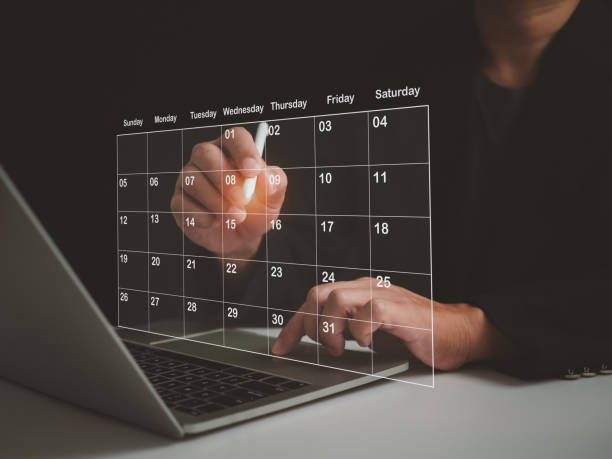 istock Businessman marking dates on virtual calendar, managing his business schedule, setting reminders for important appointments, creative collage for planning ideas, appointment scheduler 1652045603