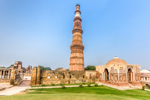 Qutub Minar Complex and Qutab Minaret Tower. The Qutub Minar was constructed in the year 1192 out of red sandstone and marble.Is the tallest minaret in India, with a height of 72.5 meters (237.8 feet). Qutub Minar, Delhi, India.