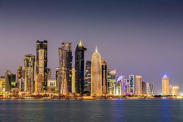 Doha Qatar by Night Modern skyscrapers illuminating the night of Qatar. Doha. Qatar Photo Collection qatar stock pictures, royalty-free photos & images