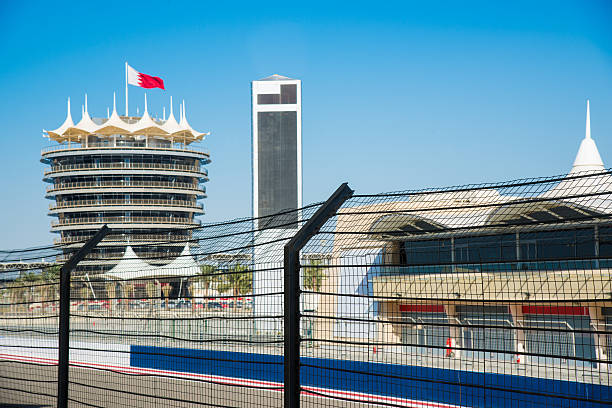 Bahrain International Circuit Pit Lane Gate at the Pit Lane of Bahrain International Circuit, open-wheel single-seater racing car Racing Track. Control Tower with Bahrain Flag. Kingdom of Bahrain, Middle East. bahrain stock pictures, royalty-free photos & images