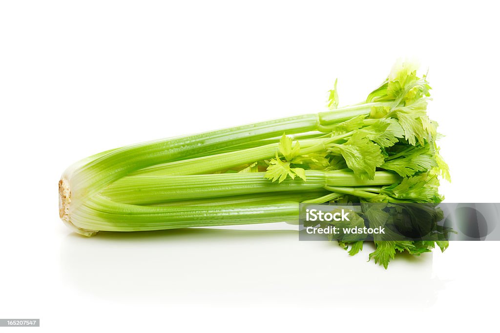 Bunch of Celery Bunch of celery isolated on white on a reflective surface. Celery Stock Photo