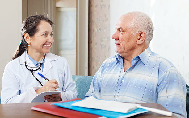 istock man  complaining to  doctor about feels 165209094