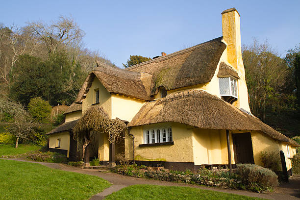 A picturesque thatched cottage in the village of Selworthy, Somerset, in Exmoor National Park