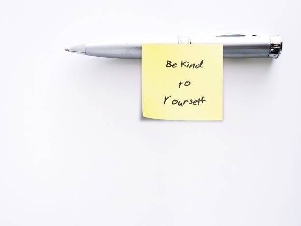 istock Pen with yellow handwritten stick note on copy space white background BE KIND TO YOURSELF, concept of self compassion - become flexible with challenging emotion when making mistake or failure 1652114303